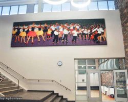 A painting on the wall of a school building in washington school.