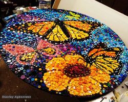 A mosaic Painting with butterflies and flowers done by a DC Artist