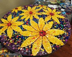 A colorful round shape mosaic made with buttons by Washington Dc, Stanley Agbontaen
