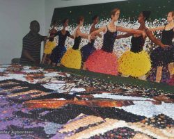 A man standing next to a large painting of dancers at art gallery dc