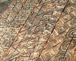 A close up of a wood panel art for school in Washington DC by local artist.